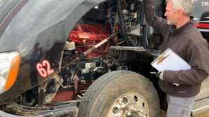 Appraiser looking at Semi-Truck